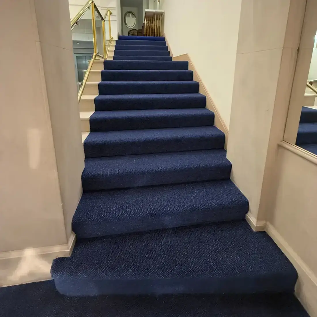 Navy carpet on a grand staircase