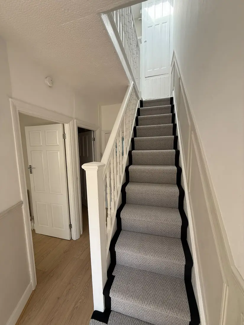 Grey stair runner with black binding