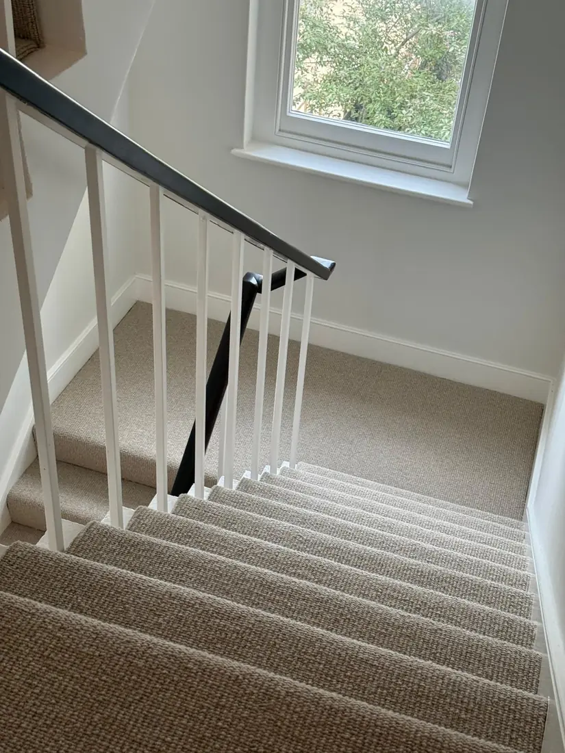Beige loop carpet on a staircase